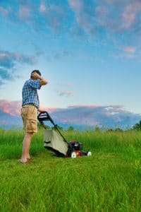 Man cutting grass with pushmower