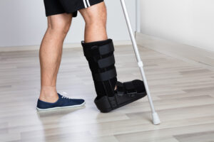 Foot and ankle injury with walking boot and crutches
