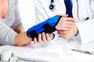 Doctor and patient arm injury