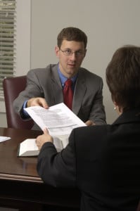 Jason Perkins talks with a client about group health insurance