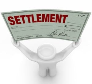 Man holding a settlement check