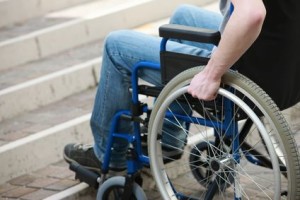 Man in wheelchair cannot go up stairs to get in house