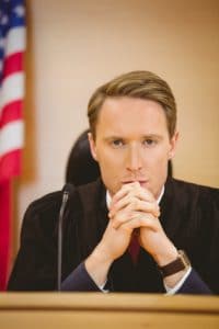 Male judge in court with american flag