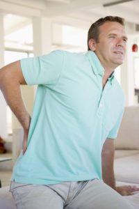 Man sitting with back pain