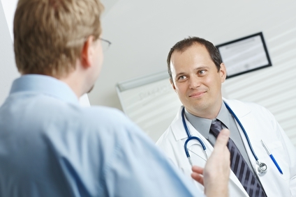 Male doctor talking with male patient