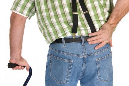 Man with injured back walking with cane